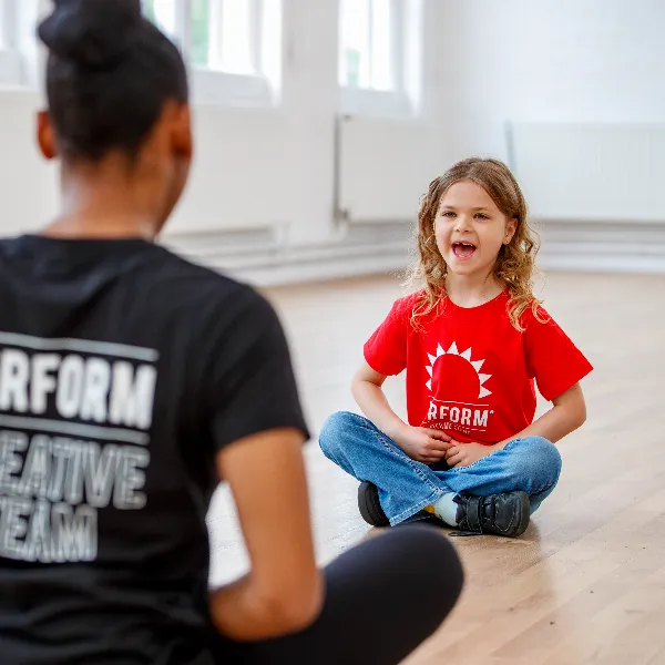 Child acting with teacher