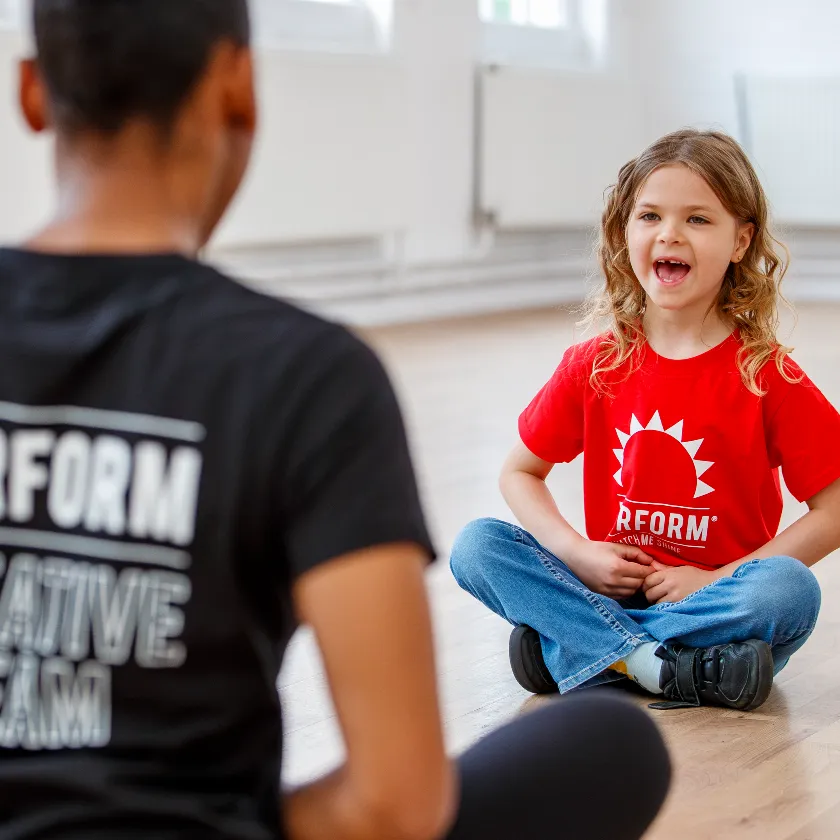 Child acting with teacher