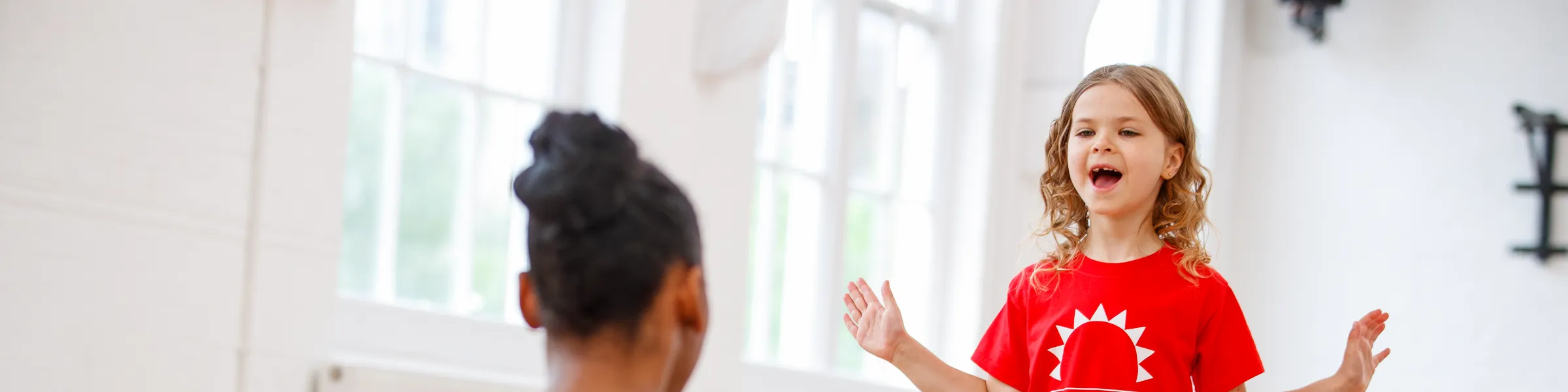 Child acting with teacher